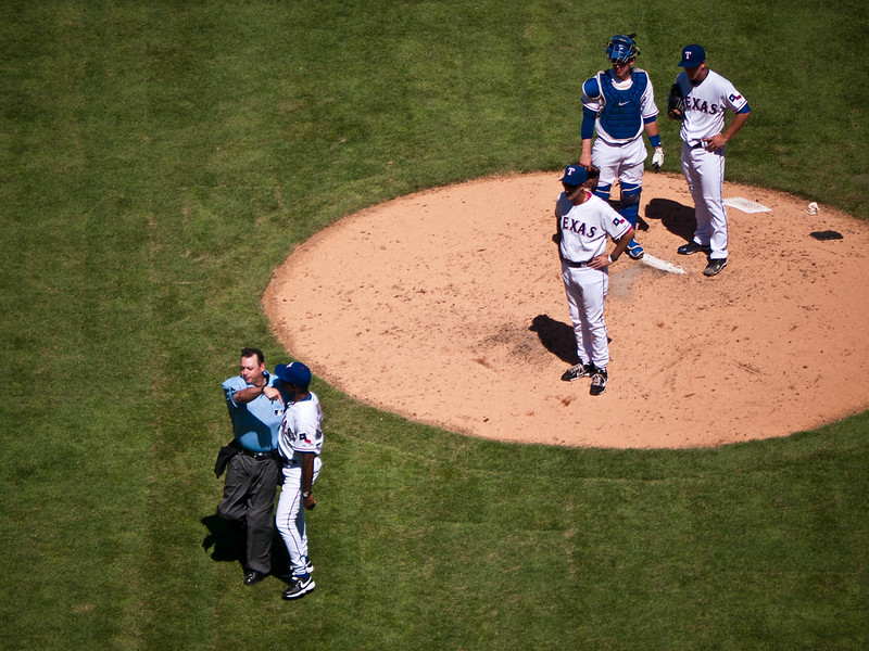 Baseball manager arguing with an umpire